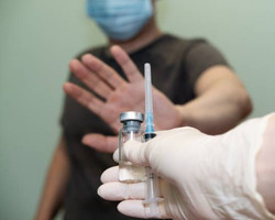 Quais os motivos que levam pessoas a recusarem tomar a vacina contra Covid?